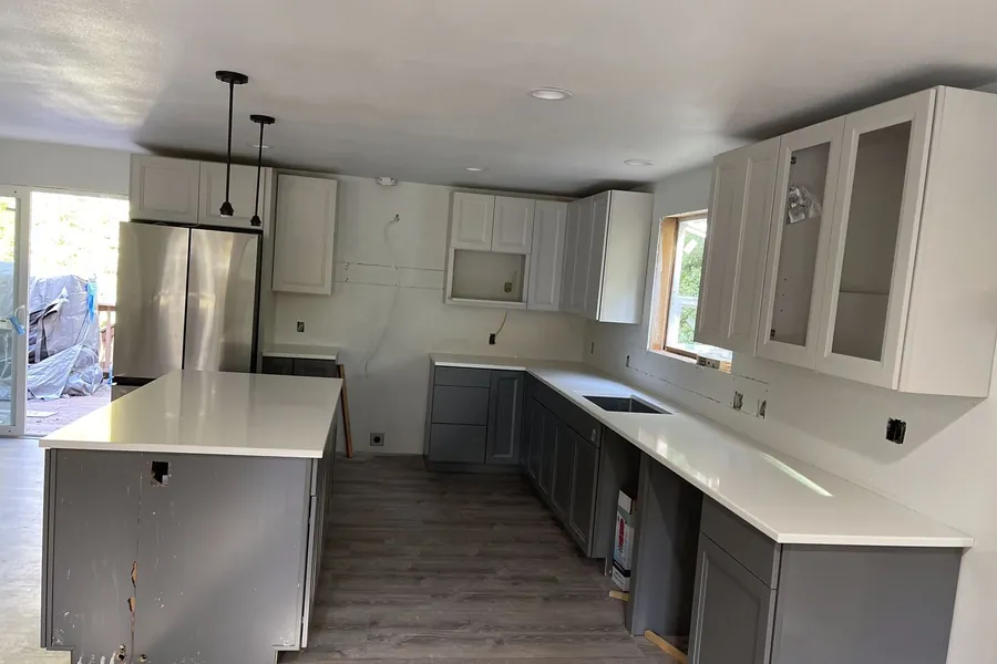 The room before we arrive — cabinets in, level, and ready for template