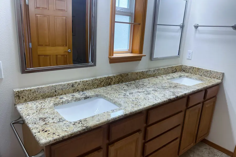 The same stone on a vanity, where it takes daily wear without complaint