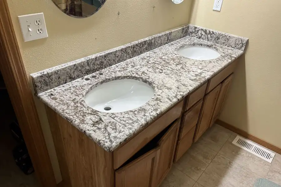 Granite vanity top with two undermount sinks