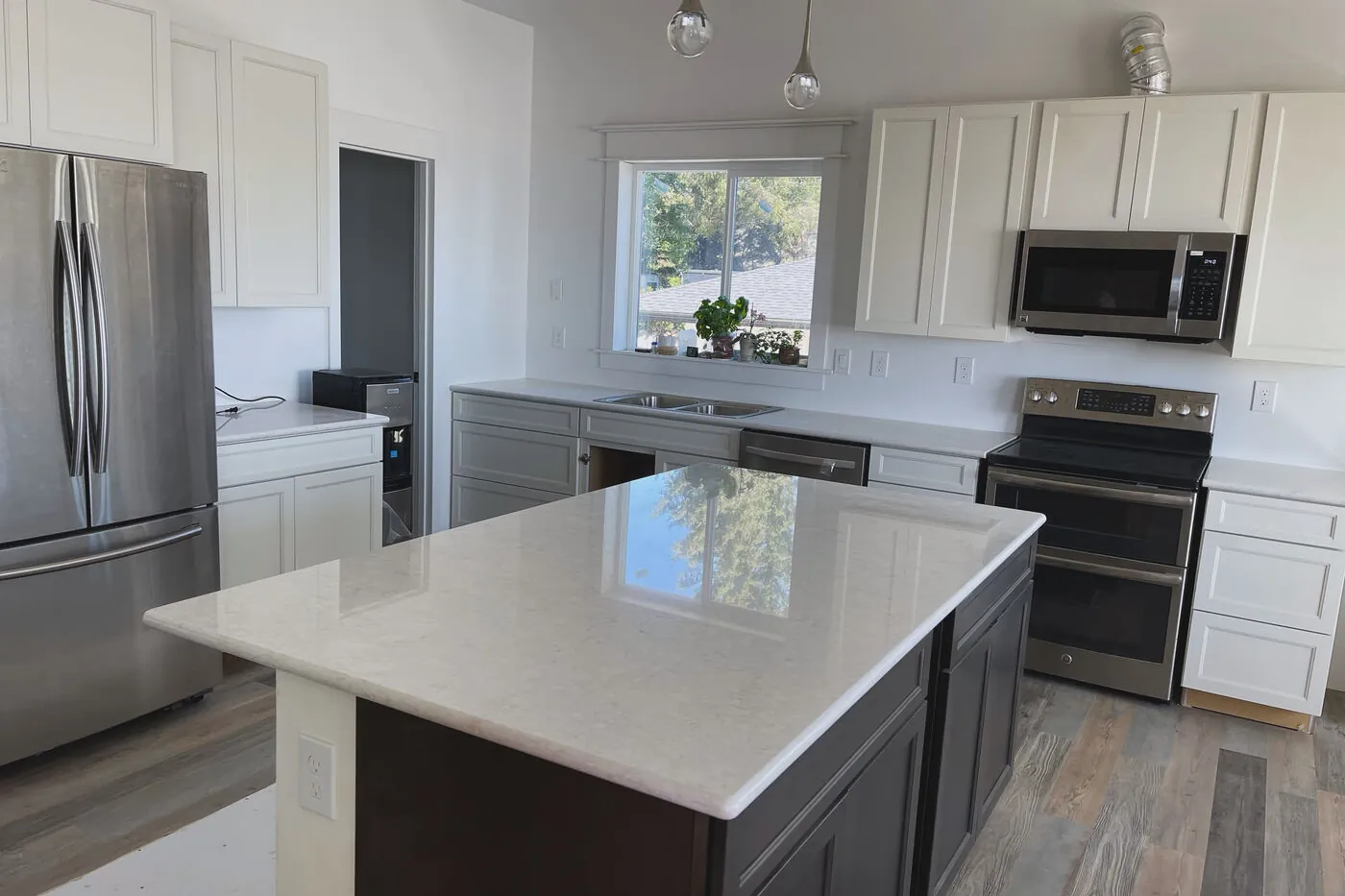 A quiet white kitchen — the safe answer, and often the right one