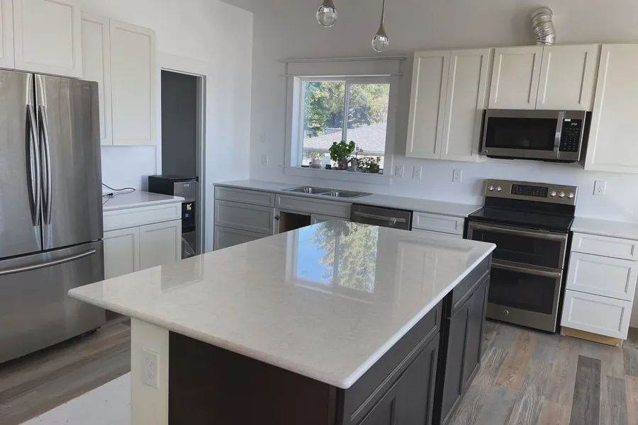 Plain white quartz — the calmest surface we sell, and the one where a seam shows most